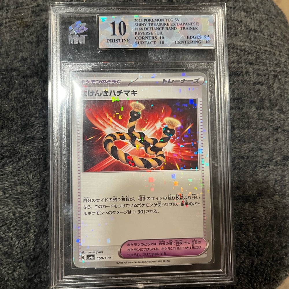 MNT Graded 10 pristine (defiance band Trainer Card)